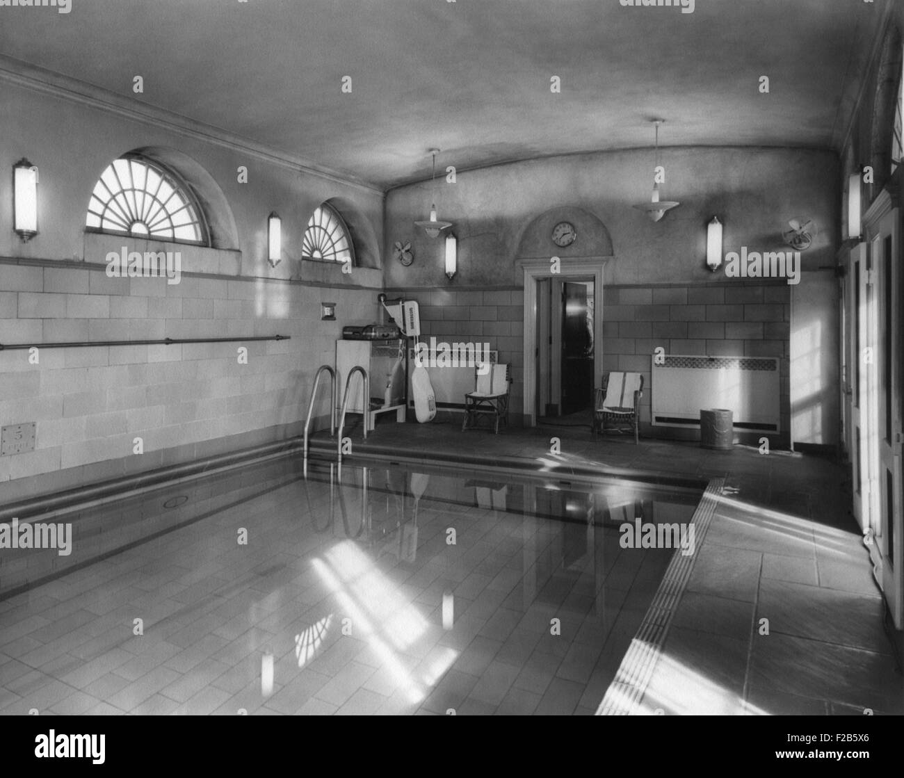 White House swimming pool during the Eisenhower administration. Jan. 27, 1956. It was installed in 1933 to allow the President Franklin Roosevelt to exercise regularly. JFK swam in a highly heated pool for his bad back. Richard Nixon converted it into a Press Room. - (BSLOC 2014 16 243) Stock Photo