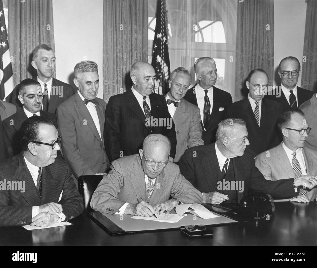 President Eisenhower initialing the first agreement for the Peaceful use of Atomic Energy. May 3, 1955. The international 'Atoms for Peace' program that supplied nuclear equipment to schools, hospitals, and research institutions throughout the world. Nuclear reactors in Iran and Pakistan were built under the program. - (BSLOC 2014 16 235) Stock Photo