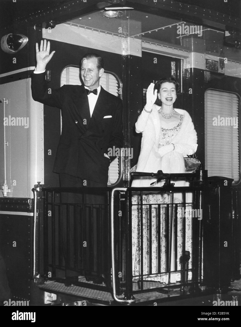 Queen Elizabeth II and Prince Philip wave from the back of a train at Union Station. After entertaining the President Eisenhower and the First Lady, they leave for New York City. Oct. 20, 1957 - (BSLOC 2014 16 217) Stock Photo