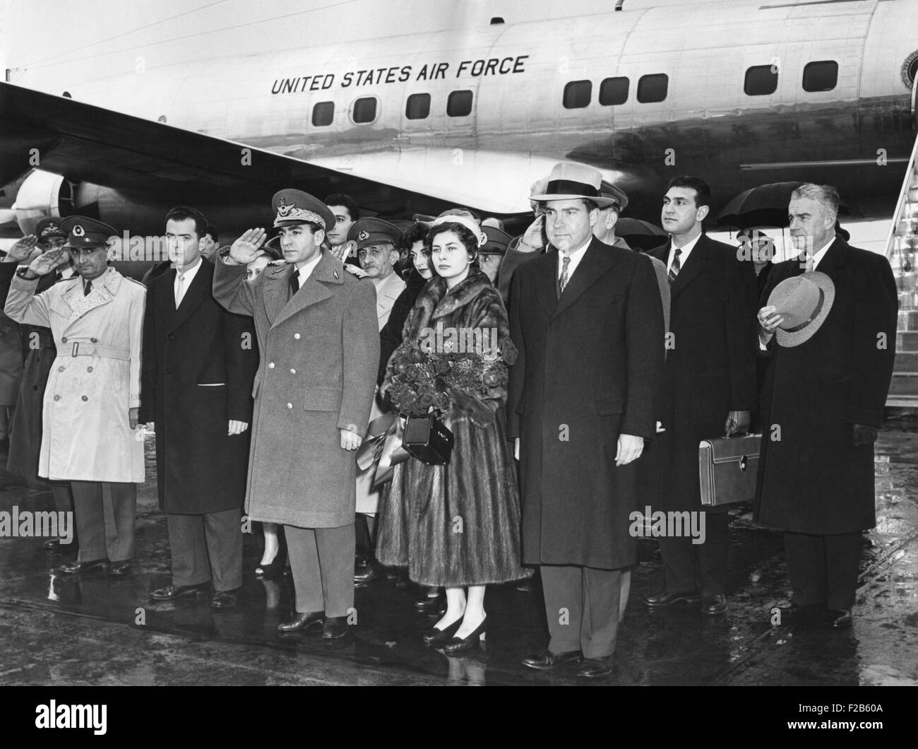 Shah of Iran and his second wife, Queen Soraya, arrive at National Airport. VP Nixon headed the welcoming party. Dec. 13, 1954. Stock Photo