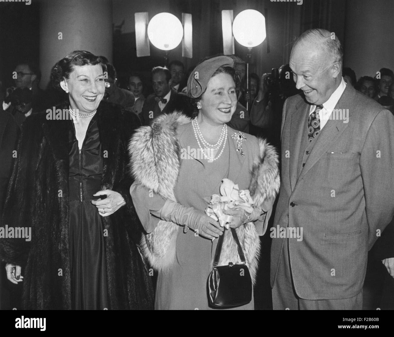 President and Mamie Eisenhower welcome Queen Elizabeth, the Queen Mother, at the White House. Nov. 4, 1954. She was given a dinner followed by a musical performance in the East Room. - (BSLOC_2014_16_203) Stock Photo