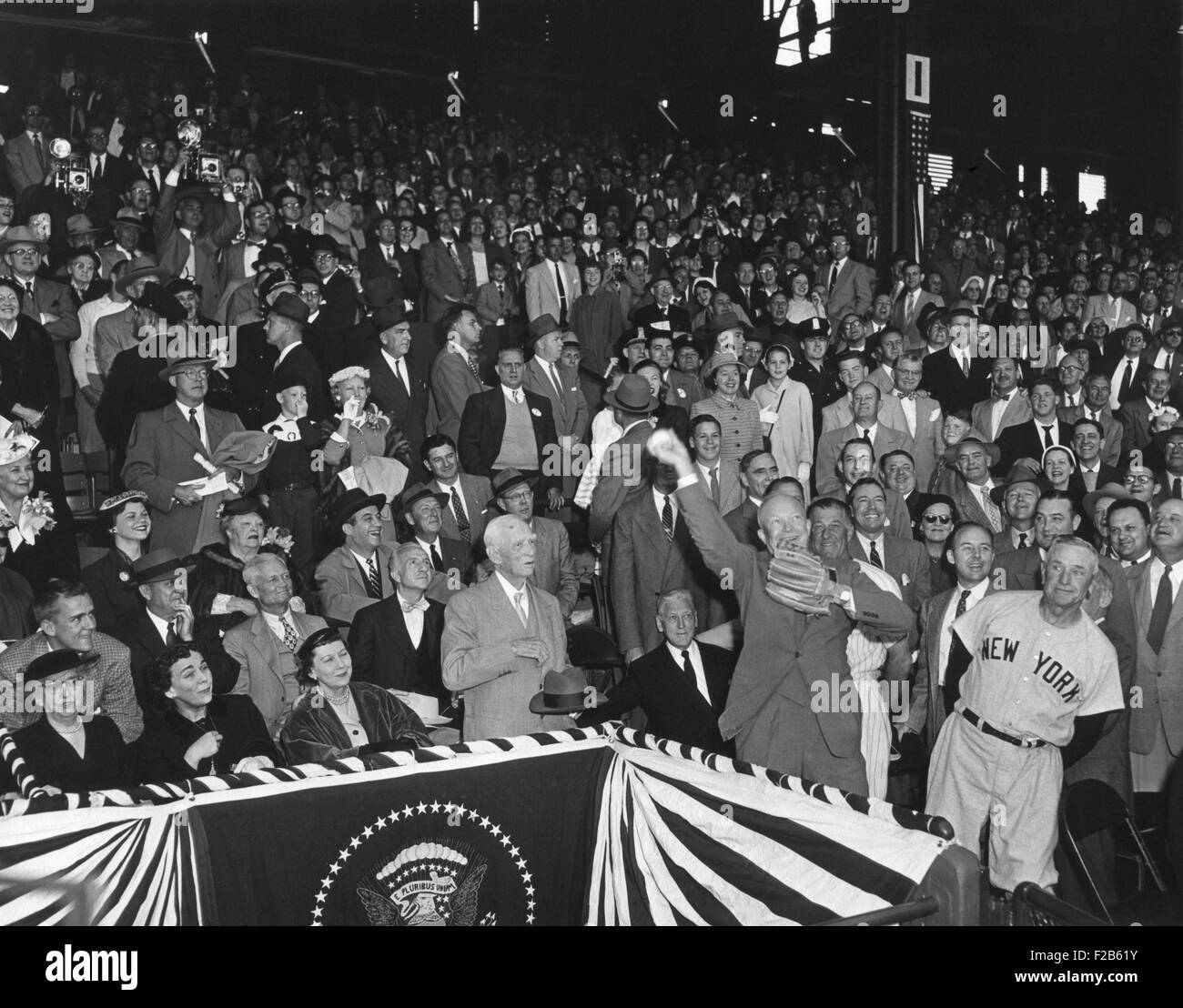 President Eisenhower throwing out the first ball of the 1954 Baseball season at Griffith Stadium. At left is Casey Stengel in the 'New York' Yankees uniform. April 13, 1954. - (BSLOC 2014 16 174) Stock Photo