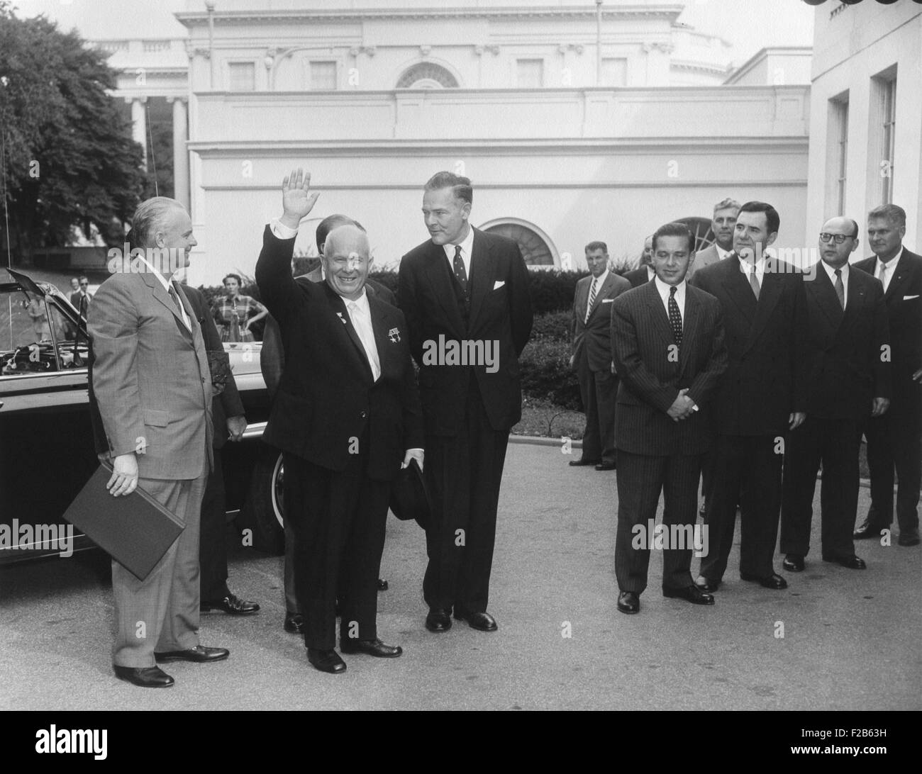 Soviet Premier Nikita Khrushchev waves as he arrives at the White House, Sept. 15, 1959. To his left is U.S. Ambassador to the UN, Henry Cabot Lodge. USSR Minister of Foreign Affairs, Andrei Gromyko, is third from right. - (BSLOC 2014 16 146) Stock Photo