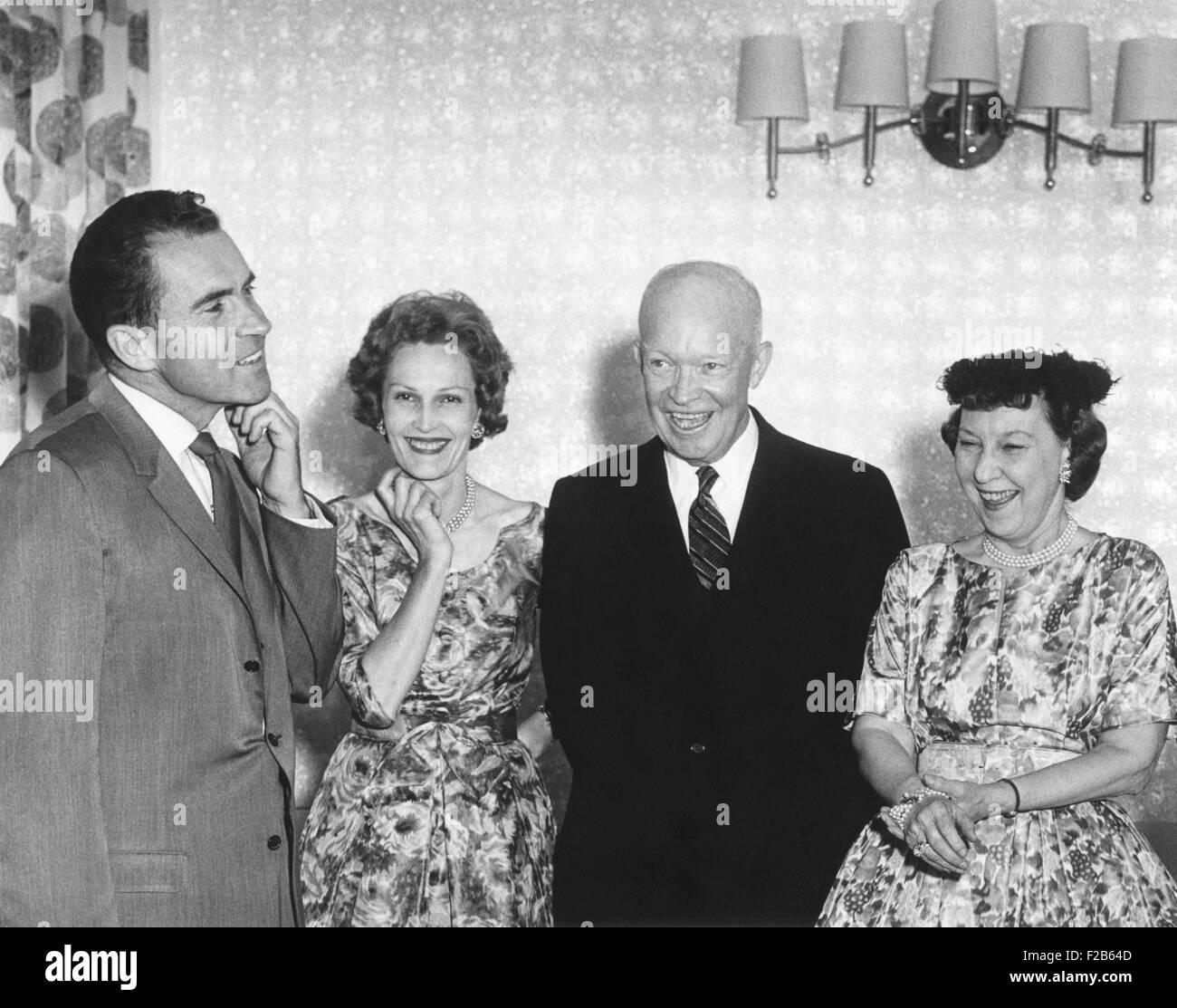 Vice President and Republican Nominee for President Richard Nixon adjusting his collar. Pat Nixon, President and Mamie Eisenhower appear amused. Aug. 24, 1960. - (BSLOC 2014 16 131) Stock Photo