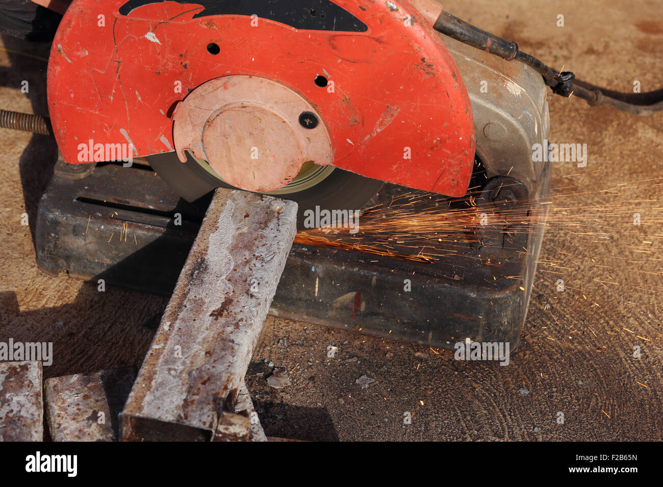 cutting a metal and steel with compound mitre saw with sharp, circular