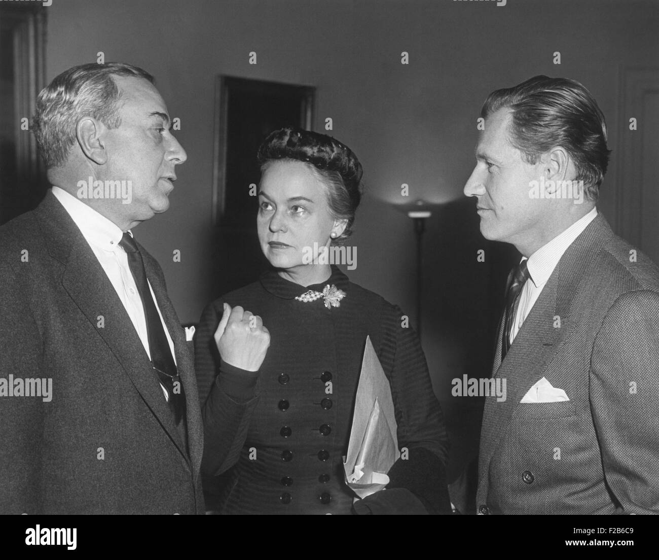 Oveta Culp Hobby flanked by Senator William Purtel and Undersecretary of HEW, Nelson Rockefeller. Dec. 11, 1953. Hobby was second female Cabinet officer and the first Secretary of Health, Education and Welfare. During World War 2 she was the first director of the Women's Army Corps. Rockefeller was instrumental in planning the government reorganization that founded the Dept. HEW - (BSLOC 2014 16 115) Stock Photo