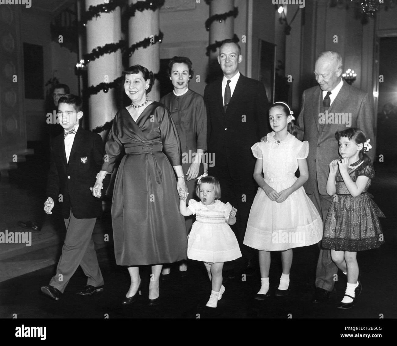 Eisenhower family Christmas at the White House. L-R: David, the First Lady, Barbara, Mary Jean, John, Barbara Ann, the President, and Susan. Ca. 1958. - (BSLOC 2014 16 112) Stock Photo