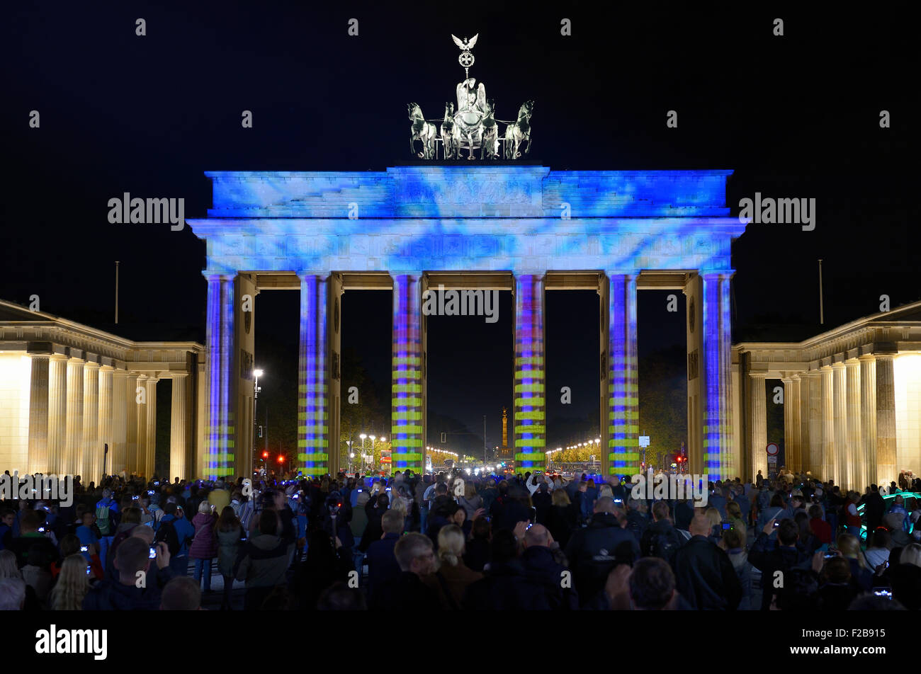Colorfully illuminated Brandenburg Gate at dusk during the Festival of Lights, Mitte, Berlin, Berlin, Germany, Europe Stock Photo