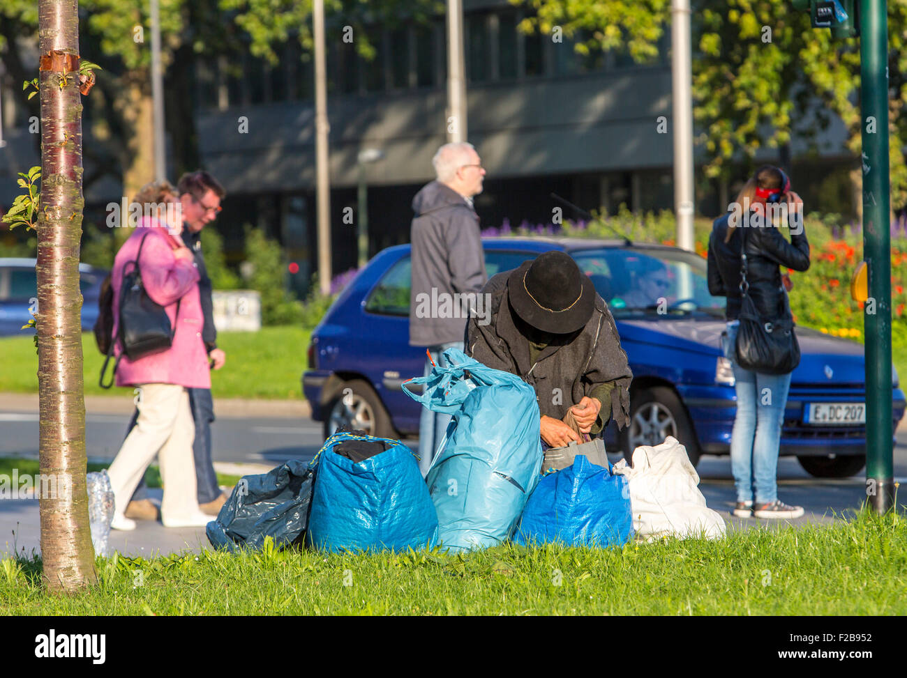 Homeless person, their belongings in plastic sacks, Stock Photo