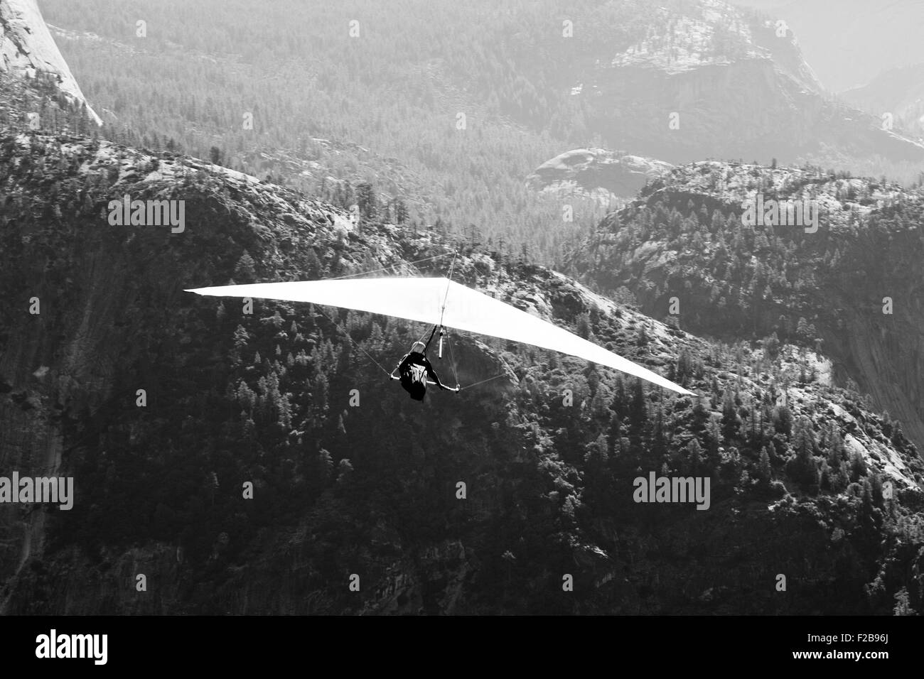 Tourist hang-gliding over a valley, Glacier Point, Yosemite Valley, Yosemite National Park, California, USA Stock Photo
