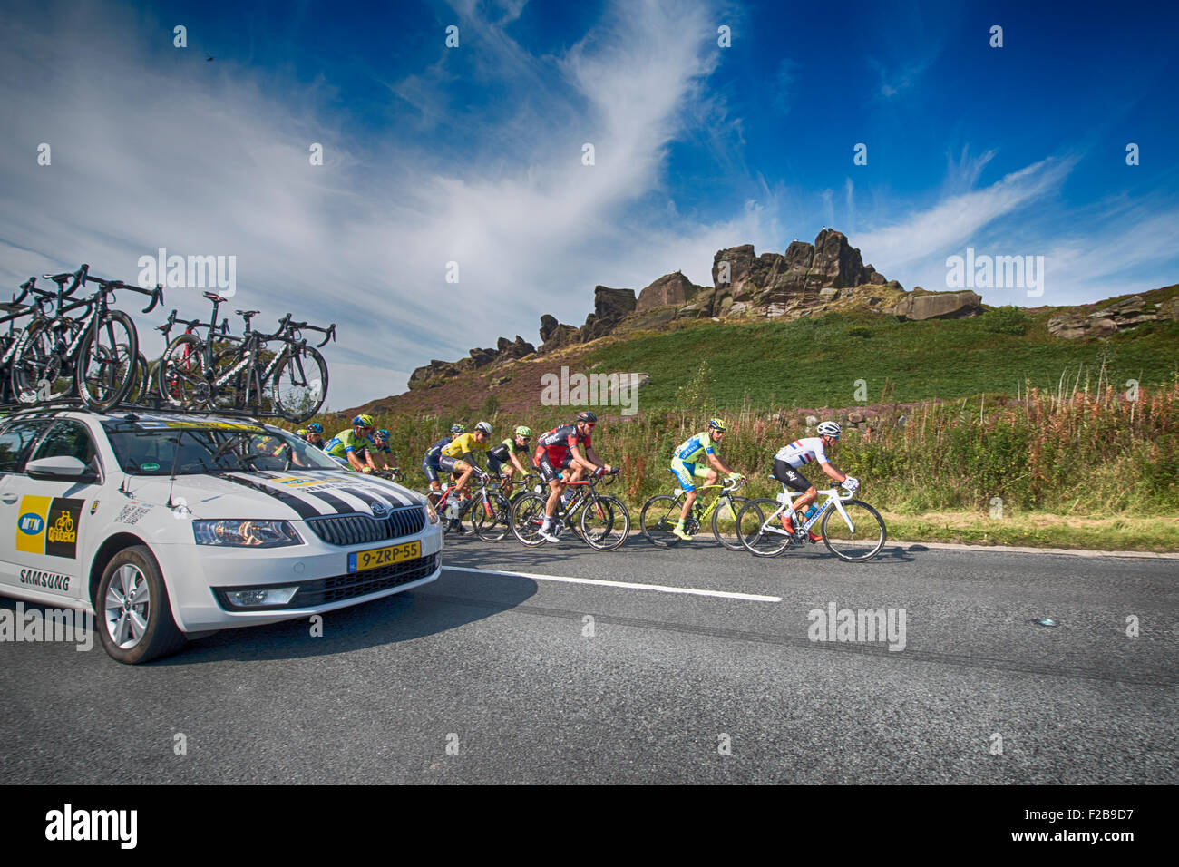 Cyclists pass a rock formation during stage six of the 2015 Aviva Tour of Britain between Stoke-on-Trent and Nottingham, UK Stock Photo