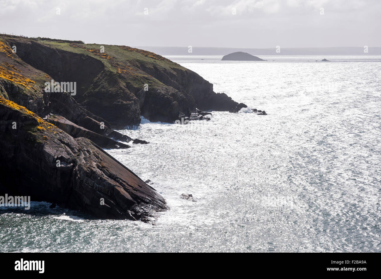 Beautiful view of sunlight sparkling off the sea at Caer bwdy bay near ...