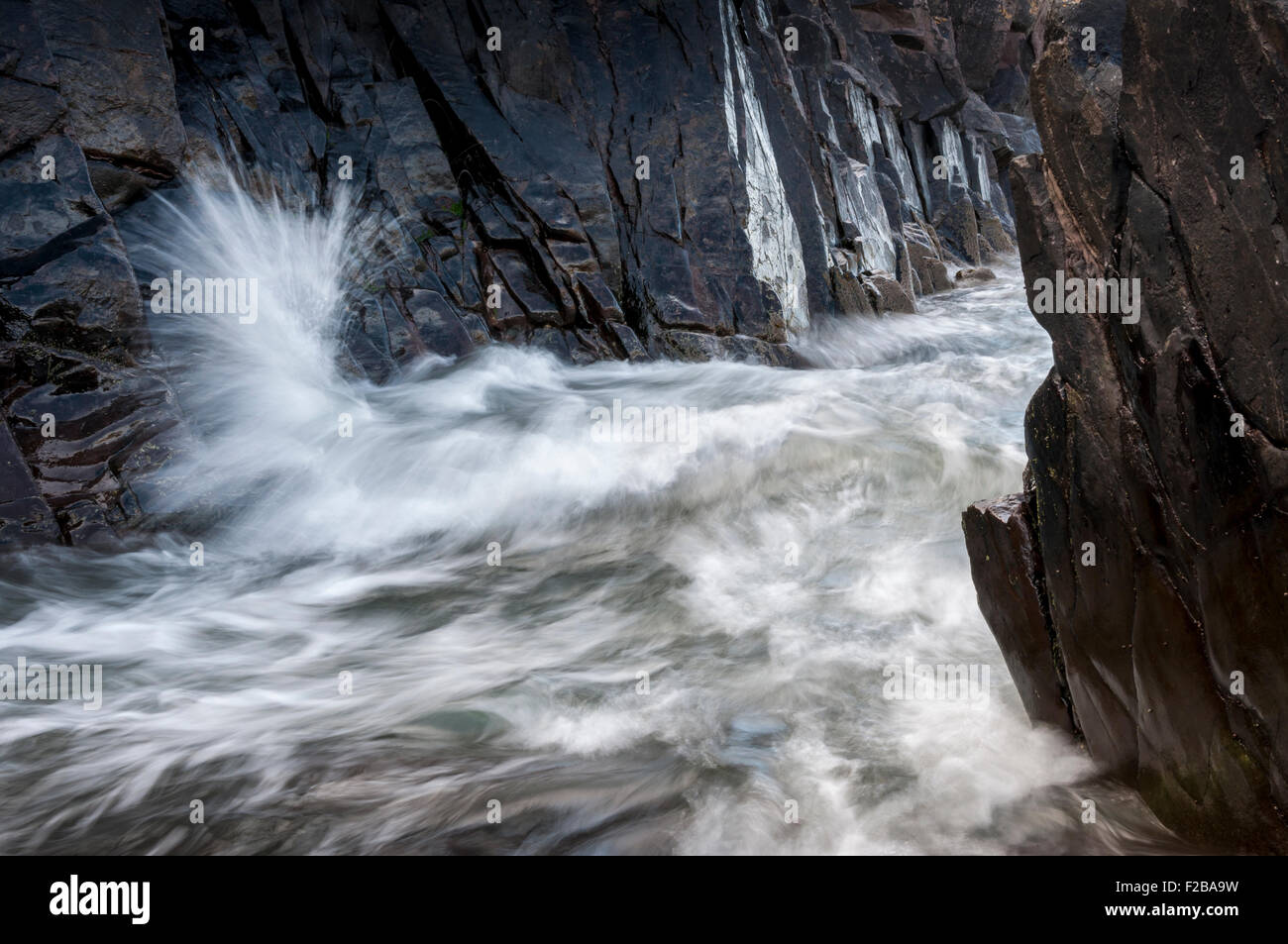Wave Passing Between Two Rocks Wave rocks hi-res stock photography and images - Alamy