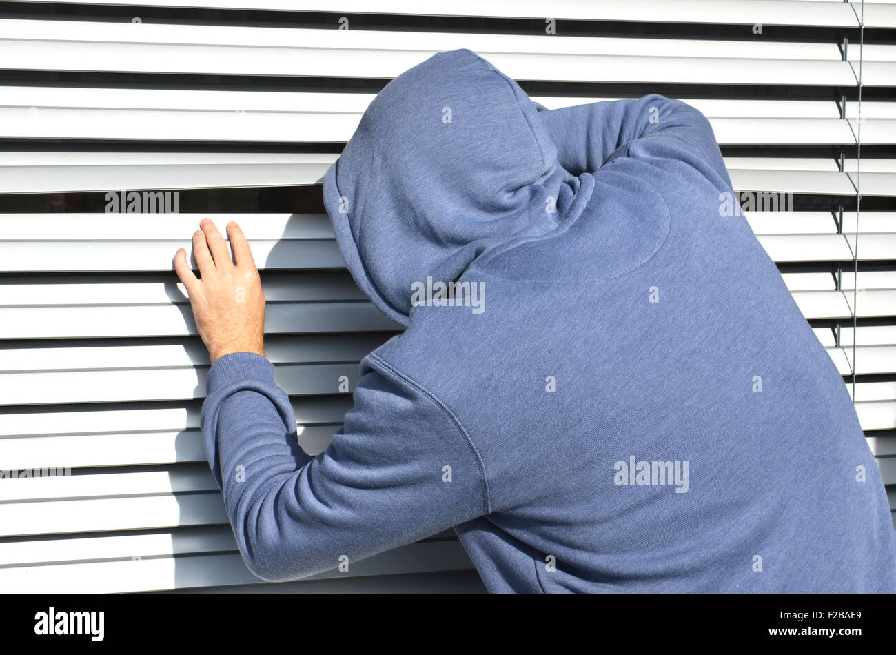 Thief at the window Stock Photo - Alamy