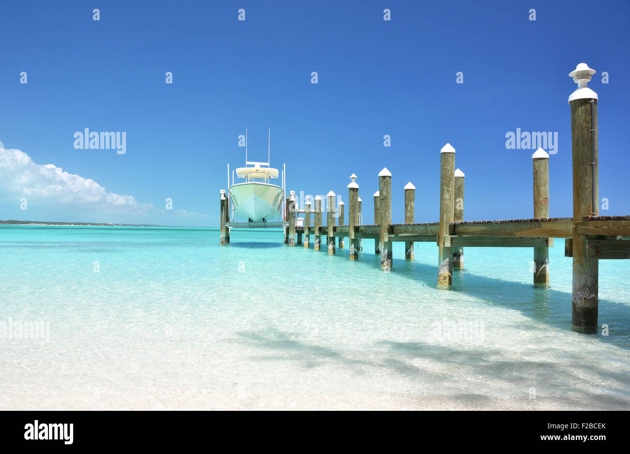 Yacht at the wooden jetty. Exuma, Bahamas Stock Photo