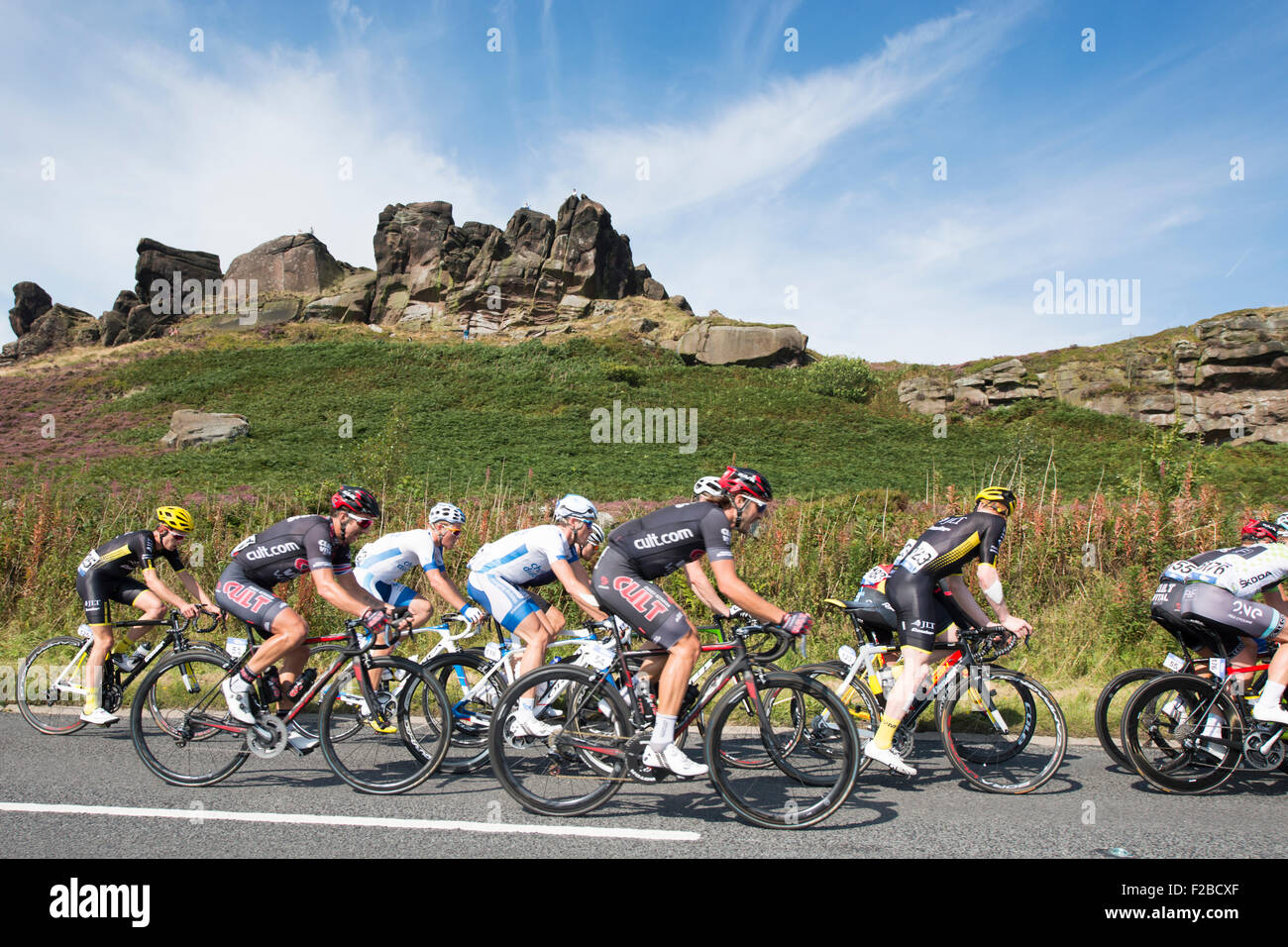 Cyclists pass a rock formation during stage six of the 2015 Aviva Tour of Britain between Stoke-on-Trent and Nottingham, UK Stock Photo