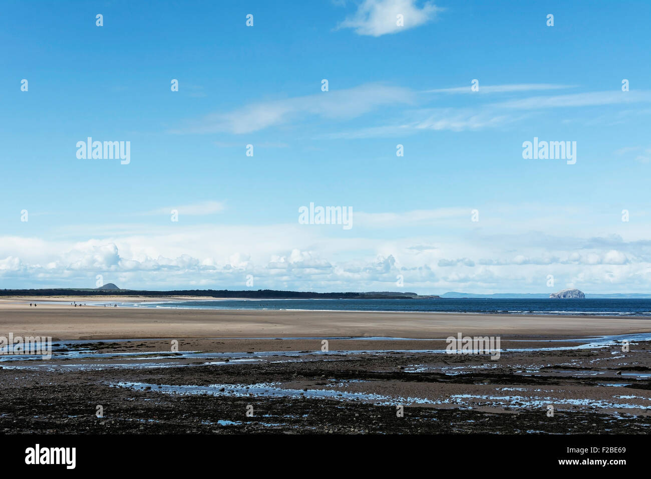 Low tide at West Barns beach, on the John Muir Way, near Dunbar, Scotland. North Berwick Law and Bass Rock are in the distance. Stock Photo