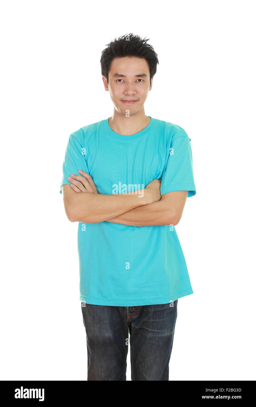 man with arms crossed, wearing green t-shirt isolated on white background. Stock Photo