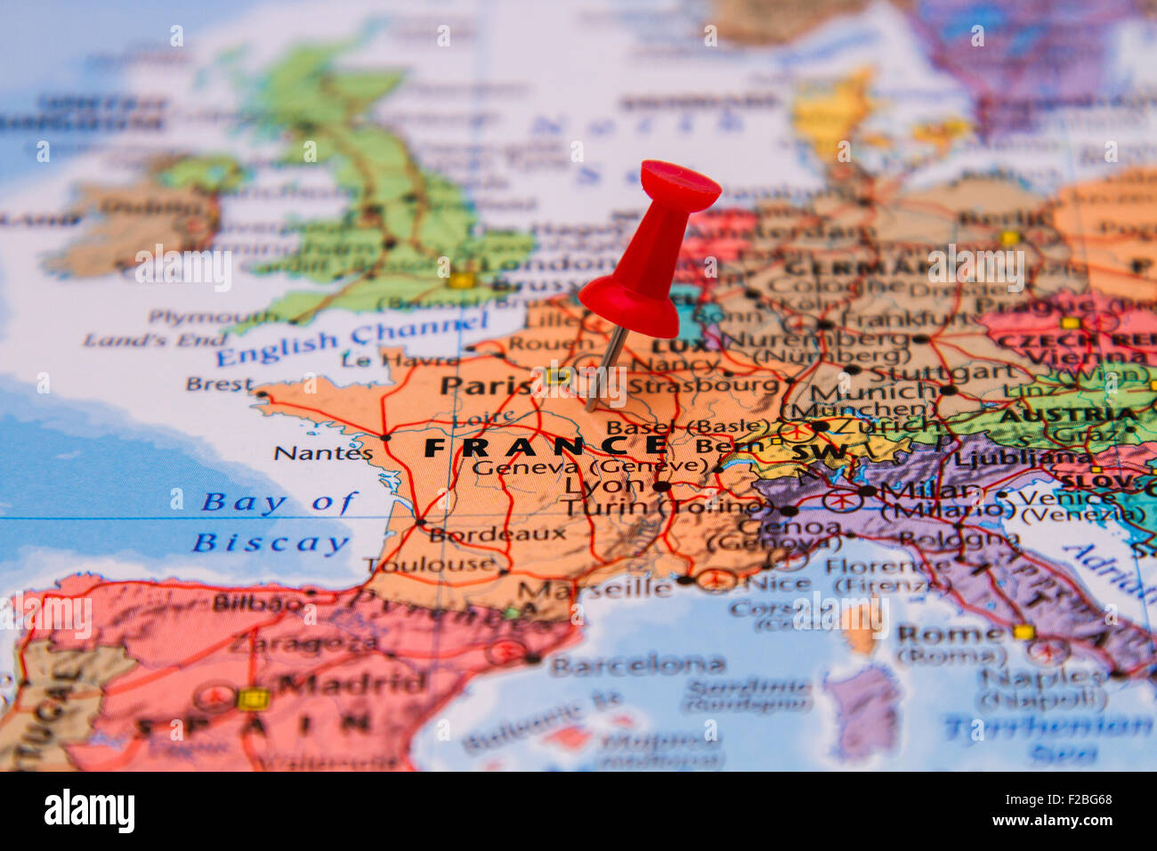 Map of France with a red pushpin stuck Stock Photo
