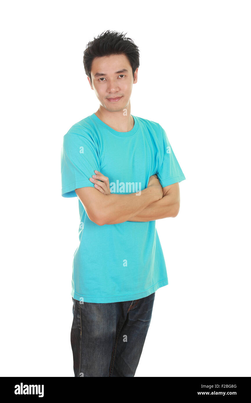 man with arms crossed, wearing green t-shirt isolated on white background. Stock Photo