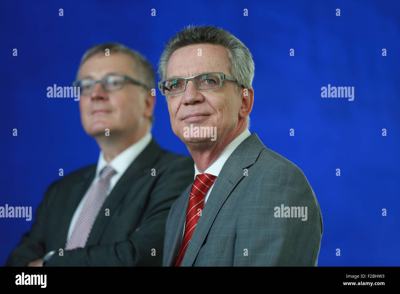 Berlin, Germany. 15th Sep, 2015. Interior Minister Thomas de Maiziere (right) and Stephan Steinlein (left) state Secretary of the German federal foreign ministry, stand after talks on the ongoing refugee crisis. Credit:  Simone Kuhlmey/Pacific Press/Alamy Live News Stock Photo
