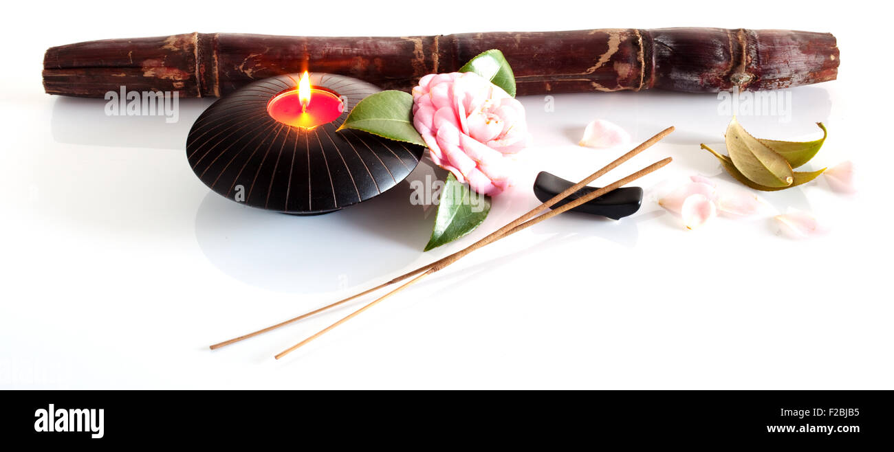 Incense and candle isolated on a white background Stock Photo