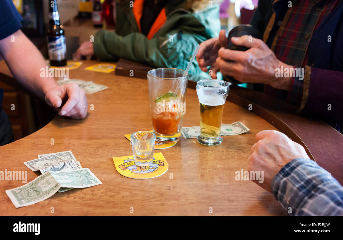Shaking dice at the bar, for drinks Stock Photo Alamy