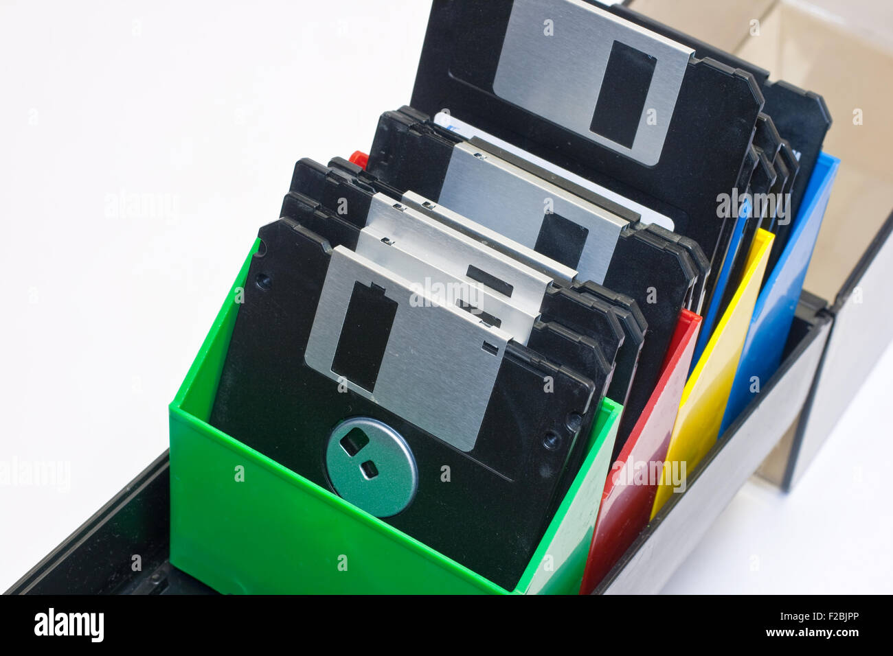 Floppy disk in a box container. White background Stock Photo