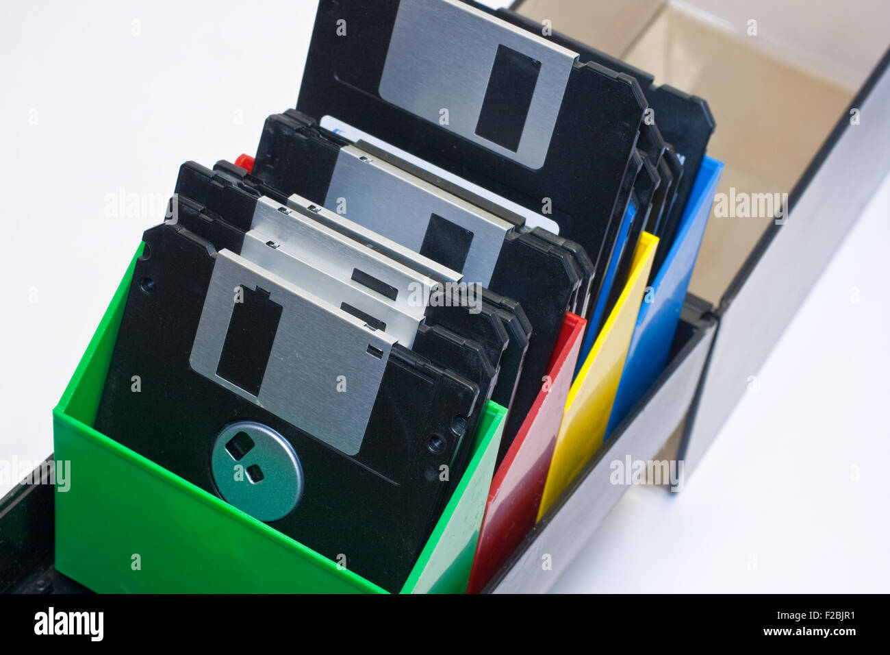 Floppy disk in a box container. White background Stock Photo