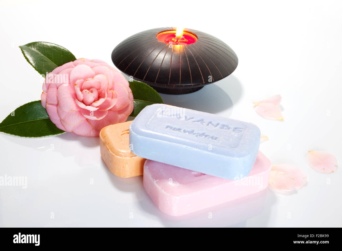 Soaps and candle on a white background Stock Photo Alamy