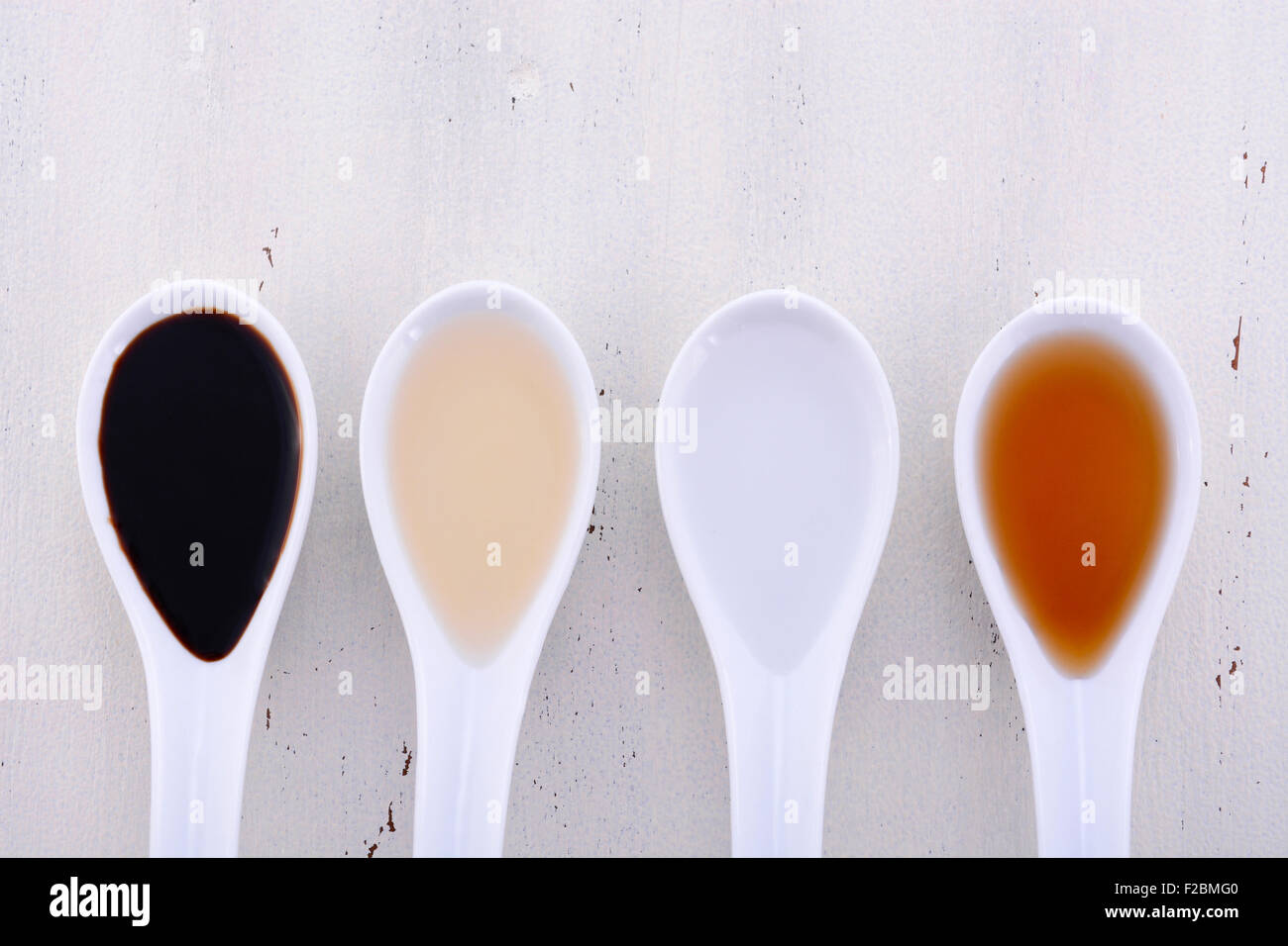 Serving size samples of different types of vinegar including Balsamic, Apple Cider, White and