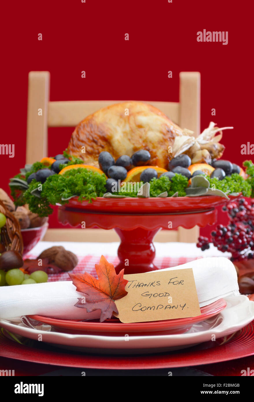 Red and white theme Thanksgiving Table setting with Roast Turkey