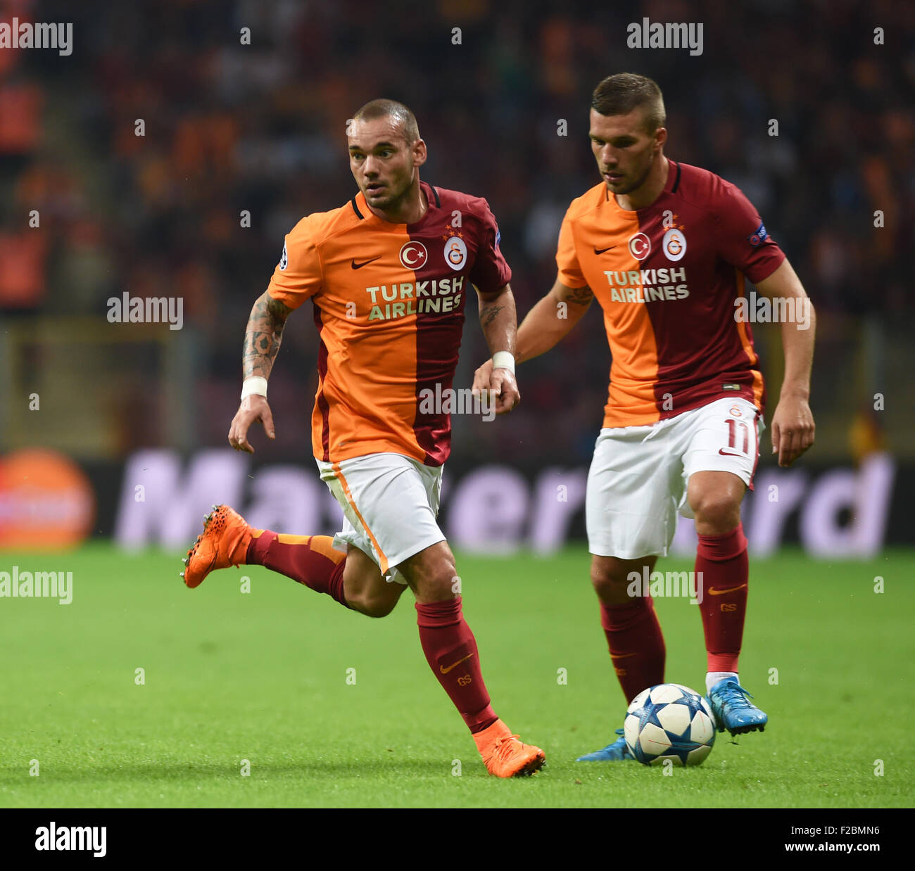 150916) -- ISTANBUL, Sept. 16, 2015(Xinhua) -- Wesley Sneijder (L) and  Lukas Podolski of Turkey's Galatasaray react during the UEFA Champions  League Group C match against Spain's Madrid Athletic in Istanbul, Turkey,