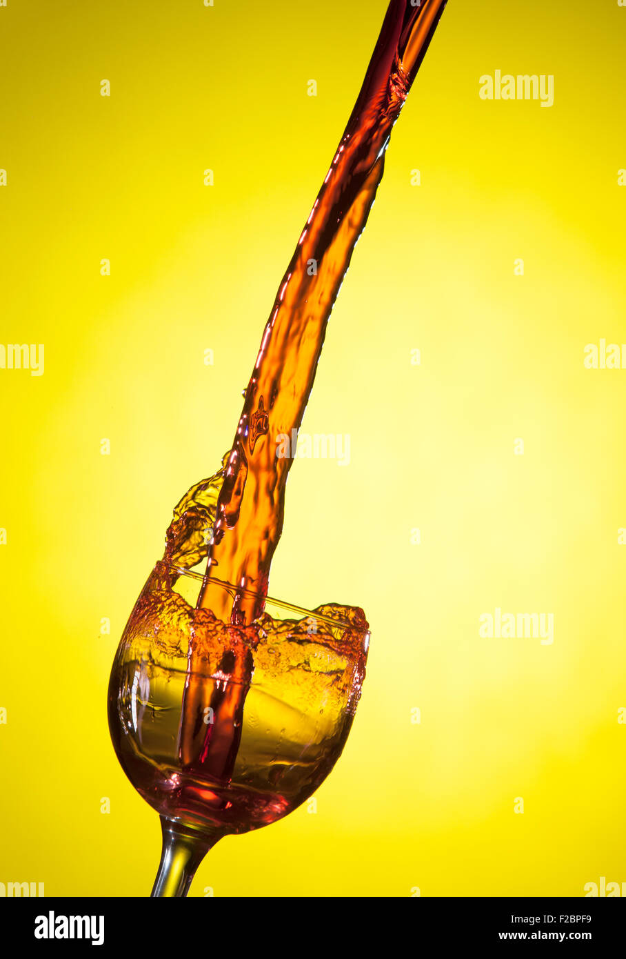 Wine pouring into a glass. Stock Photo