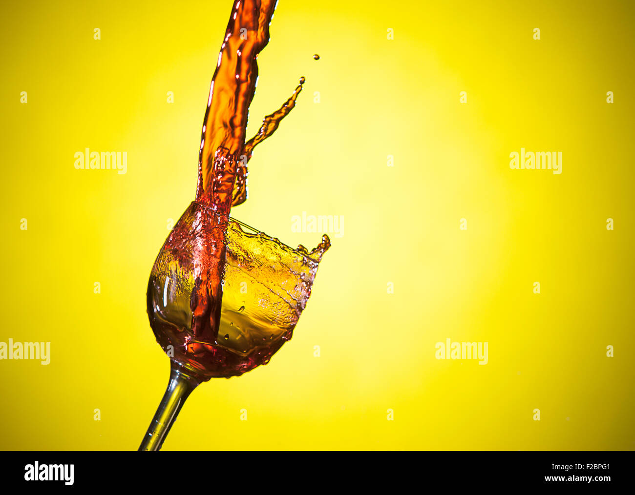 Red wine, yellow background. Stock Photo