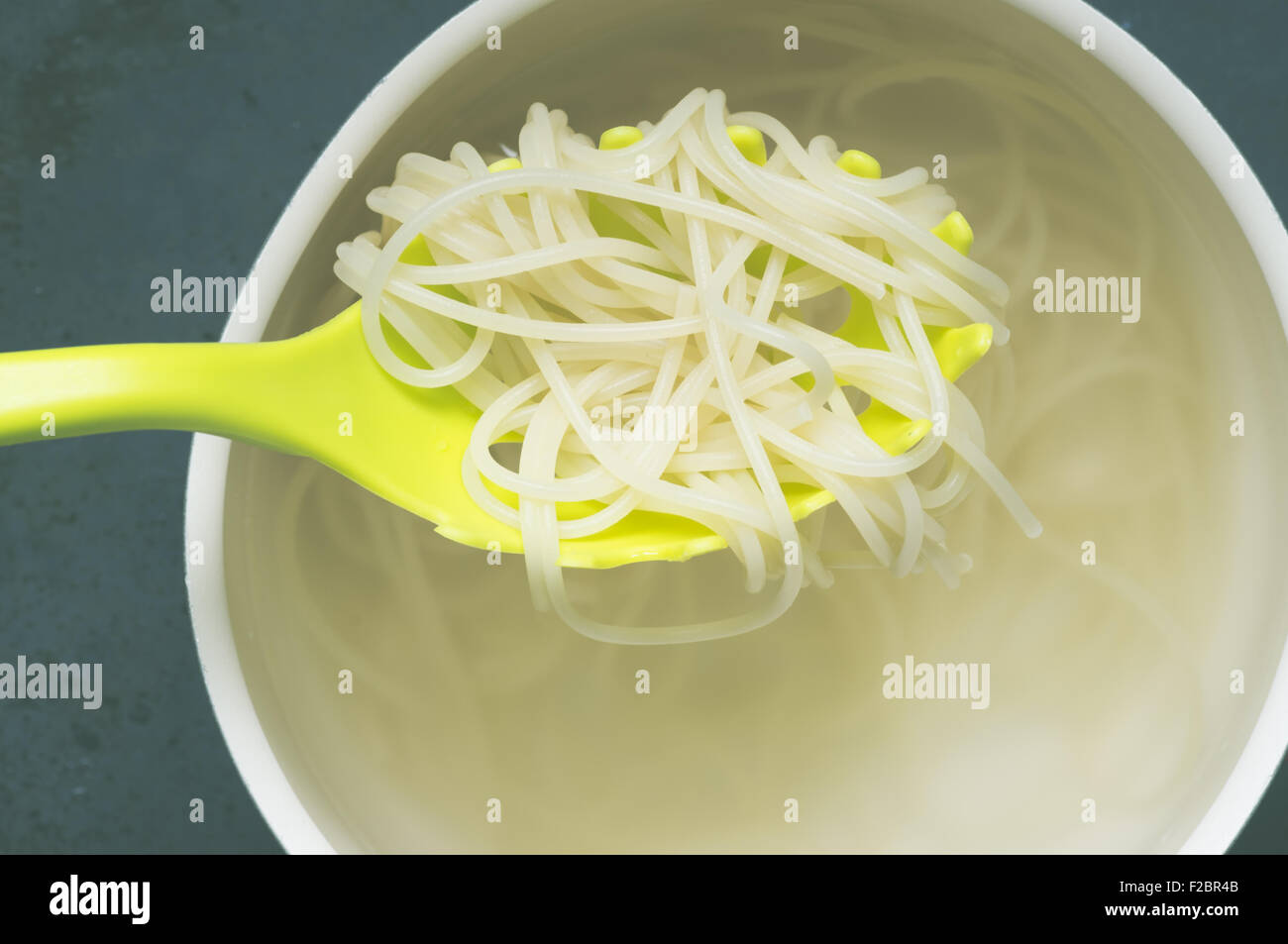 Spaghetti in a special spoon view from above Stock Photo