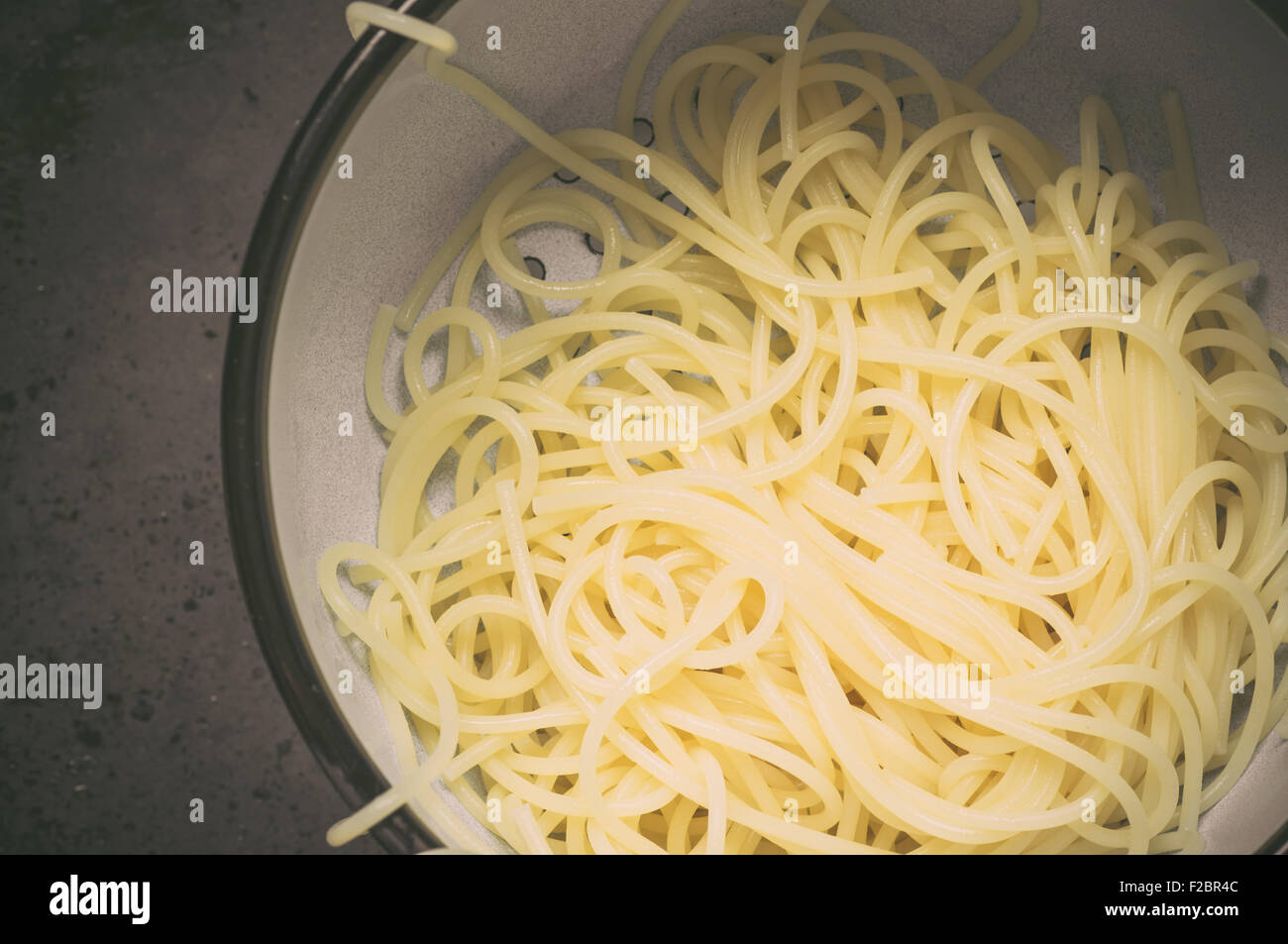 Pasta in enamel colander top view Stock Photo Alamy