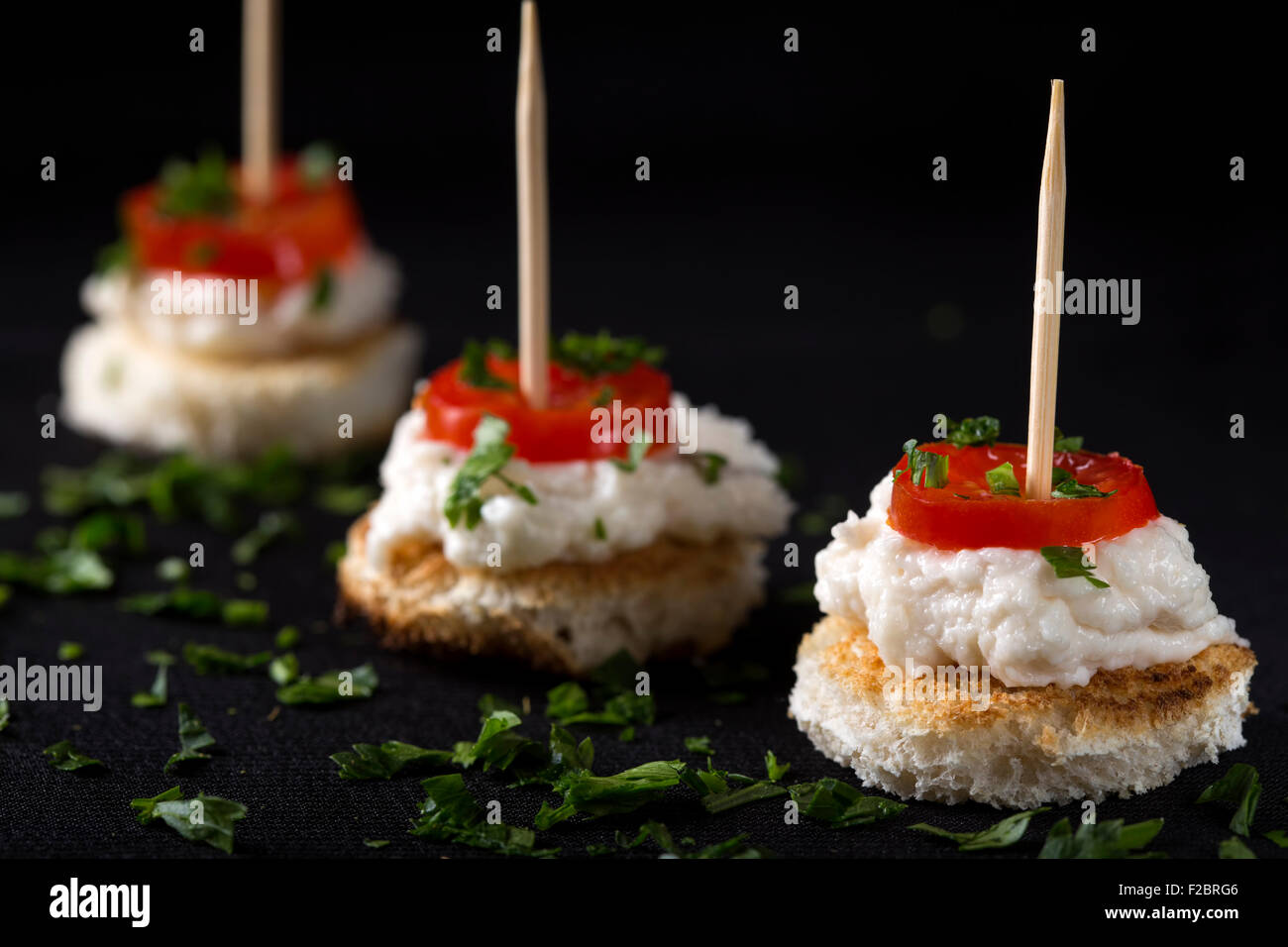 Roe salad appetizer with bread and tomatoes Stock Photo