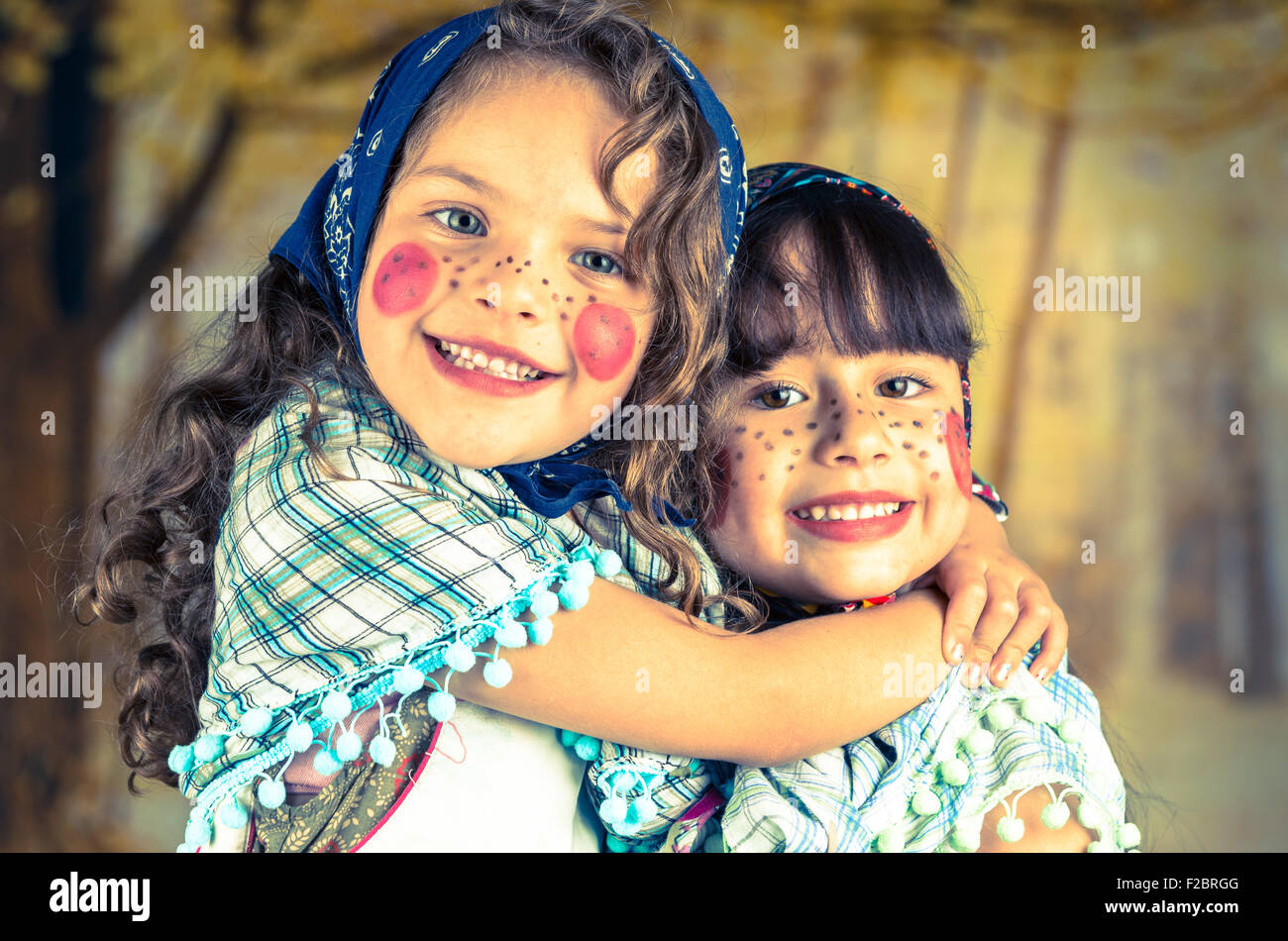 Sweet little girls dressed as a traditional witches Stock Photo