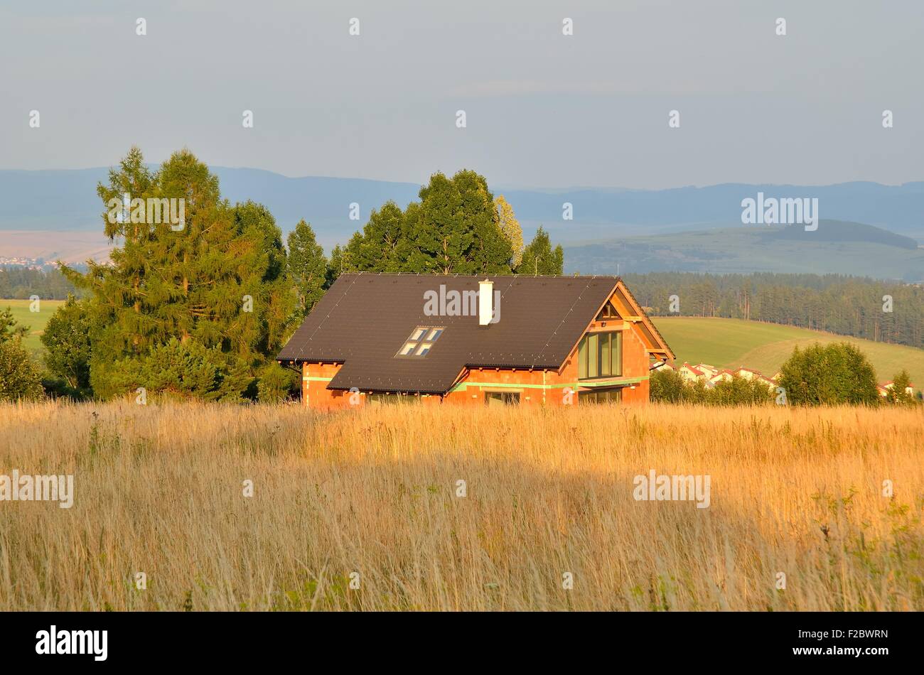 Home construction. Summer rural landscape and building. Stock Photo