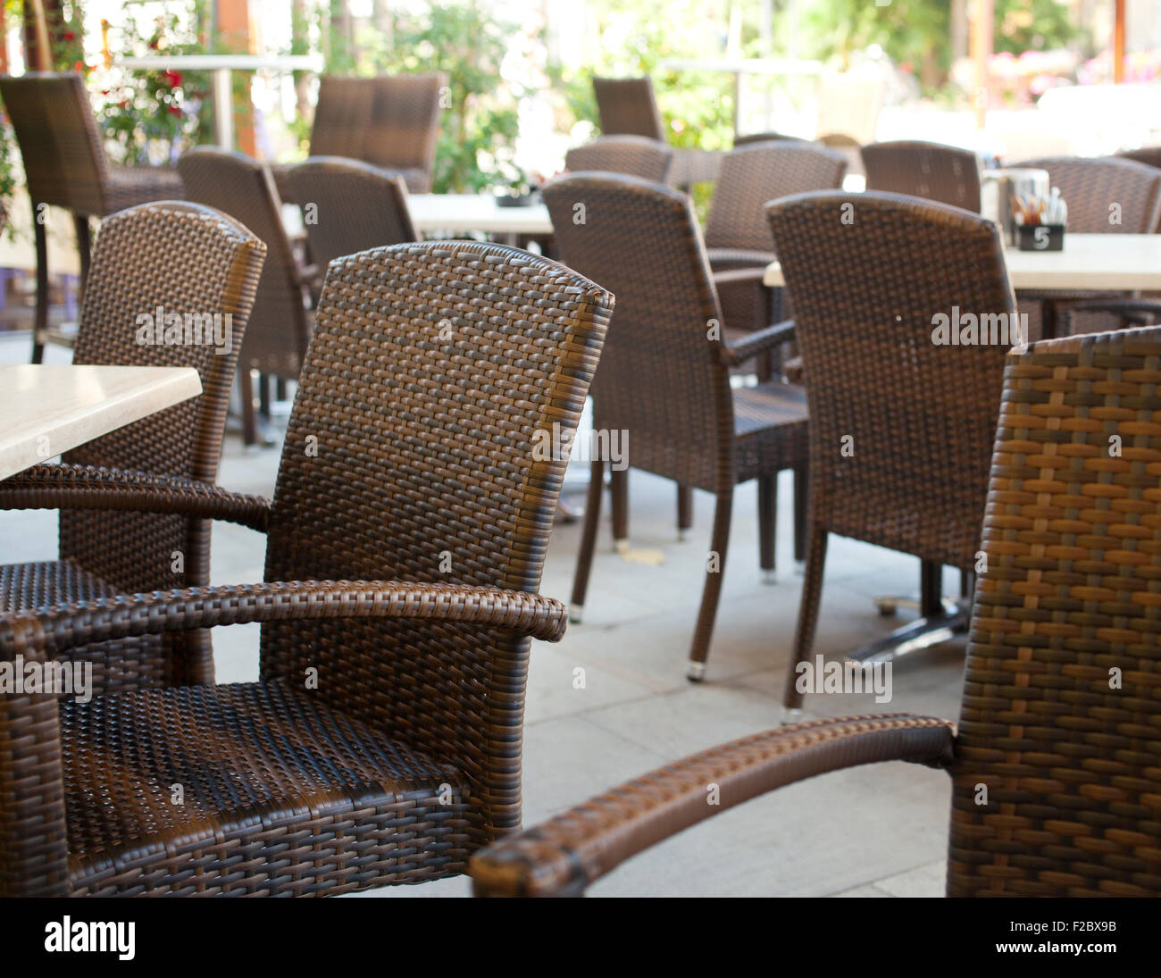 Table and wicker chairs of a coffee bar Stock Photo
