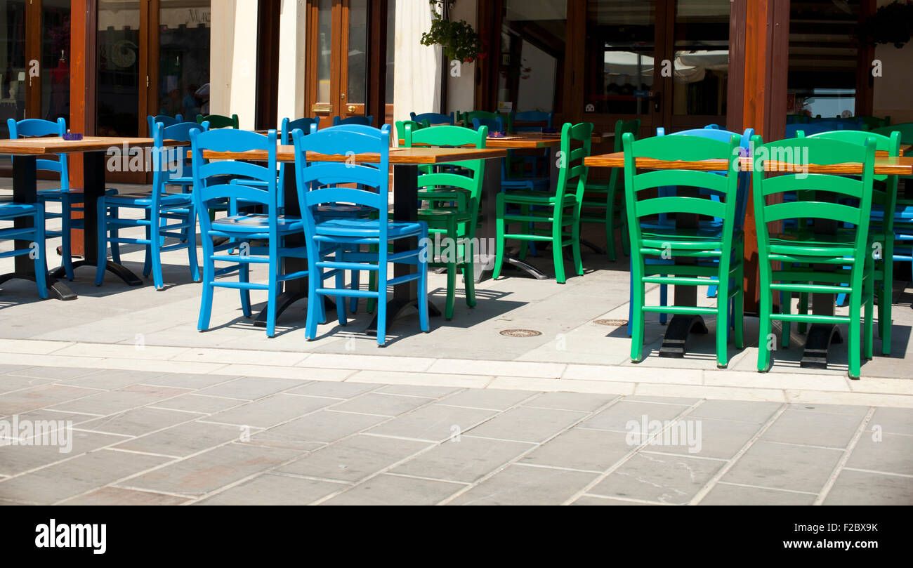Blue and green chairs of a restaurant Stock Photo Alamy