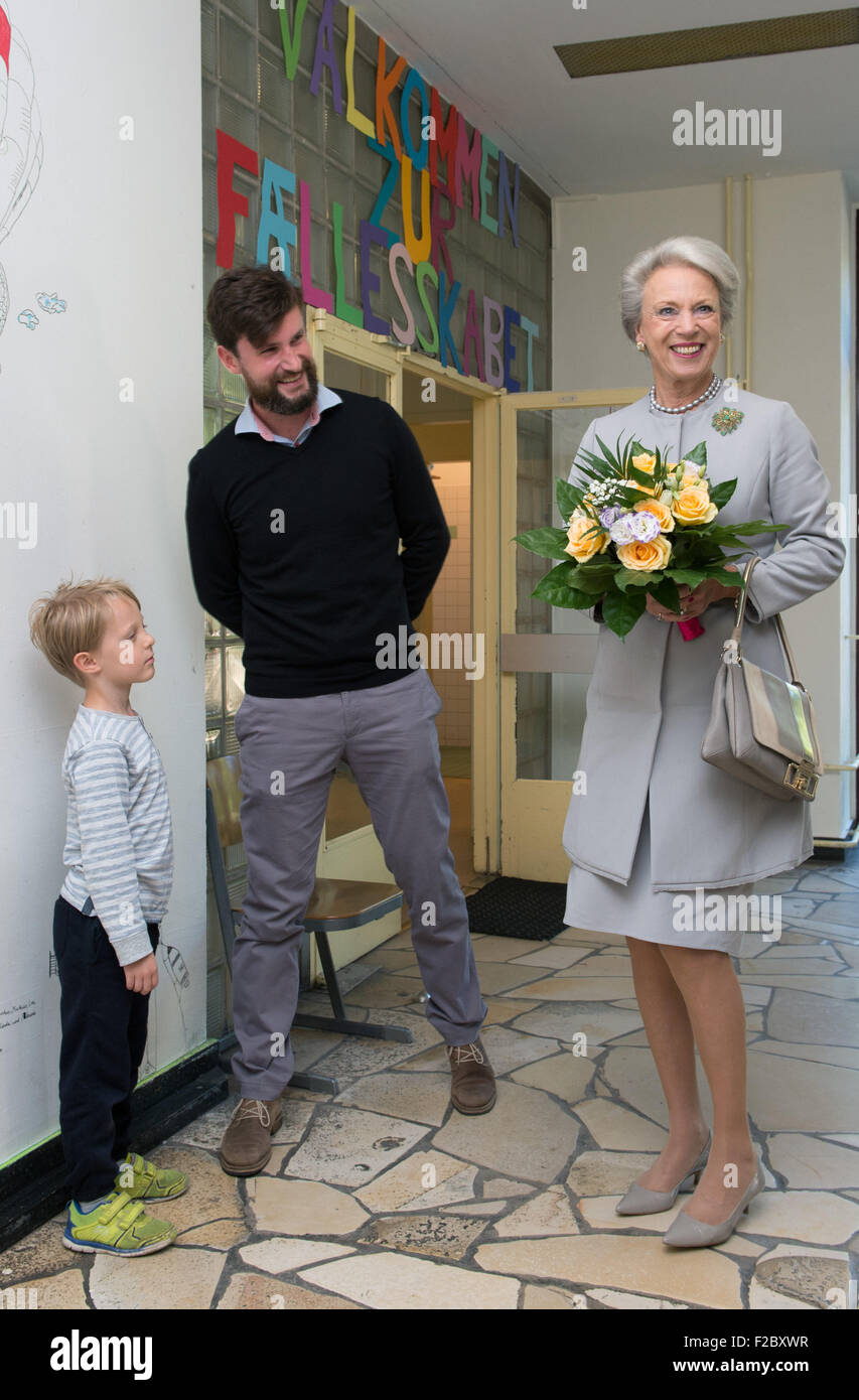 Princess Benedikte (R) of Denmark is greeted by five-year-old Sebastian Drury (L) and teacher Kim Orama during a visit to the German-Scandinavian Common School in Berlin, Germany, 15 September 2015. Photo: SOEREN STACHE/dpa Stock Photo