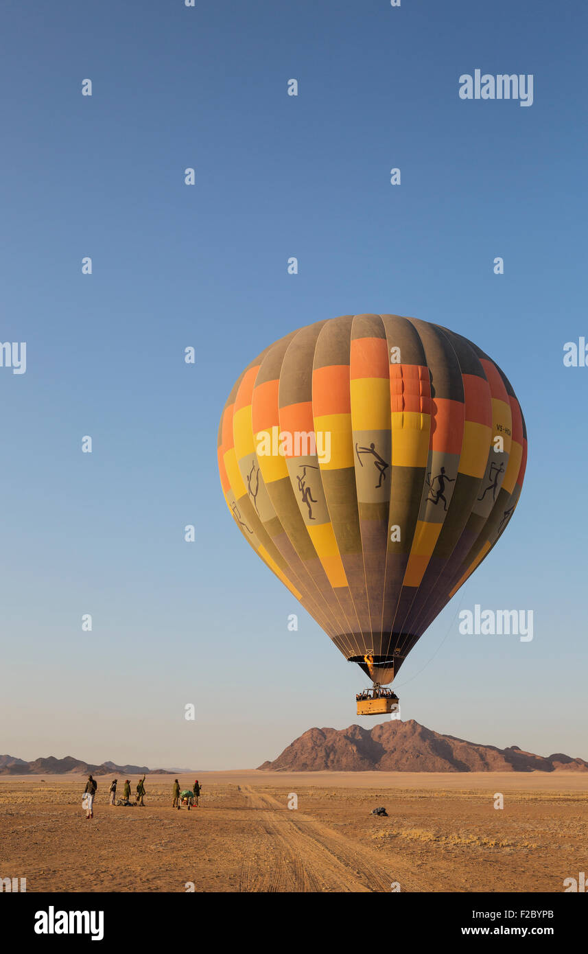 Hot-air balloon just taken-off in the early morning, Namib Desert, Kulala Wilderness Reserve, Namibia Stock Photo
