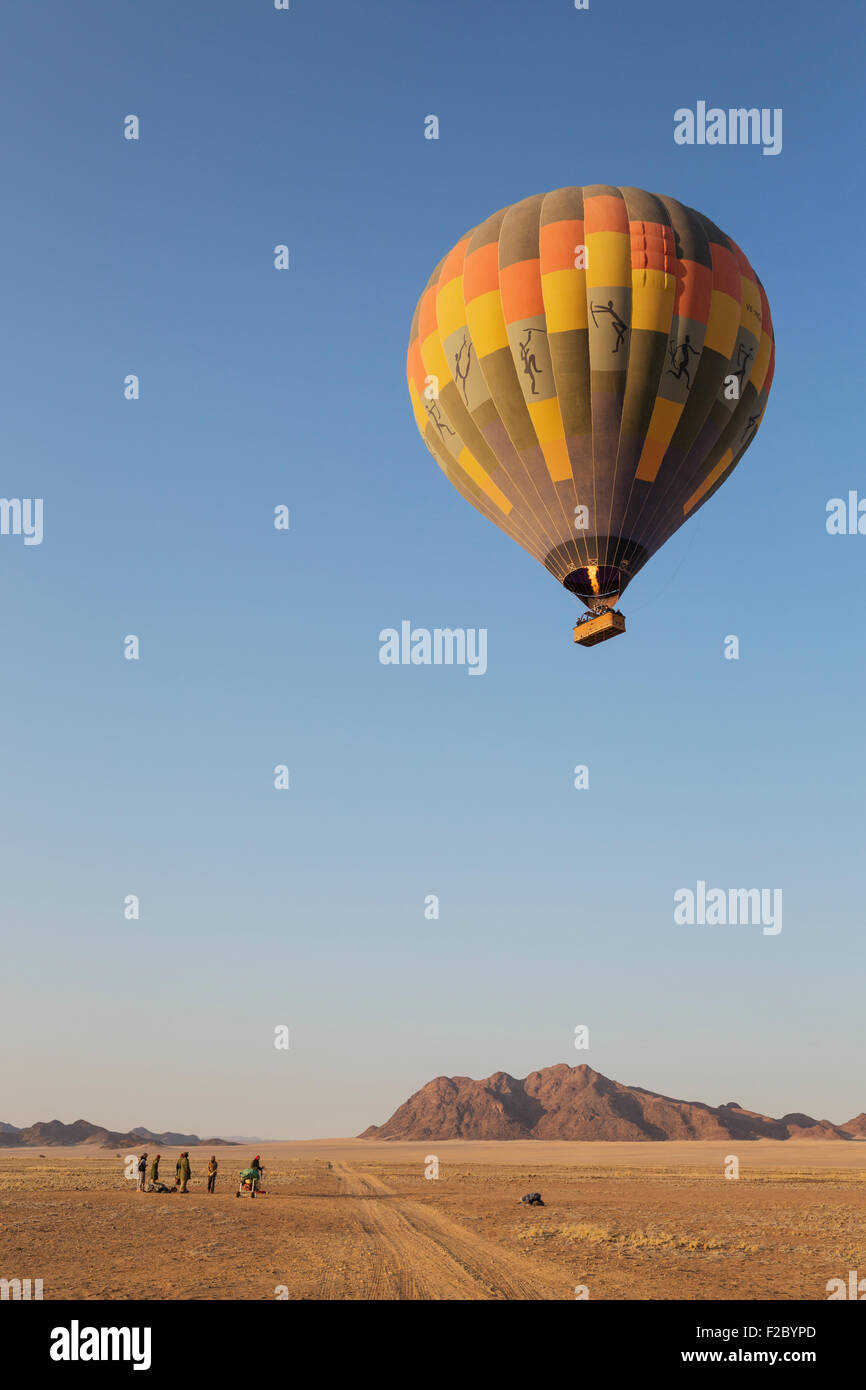 Hot-air balloon just taken-off in the early morning, Namib Desert, Kulala Wilderness Reserve, Namibia Stock Photo
