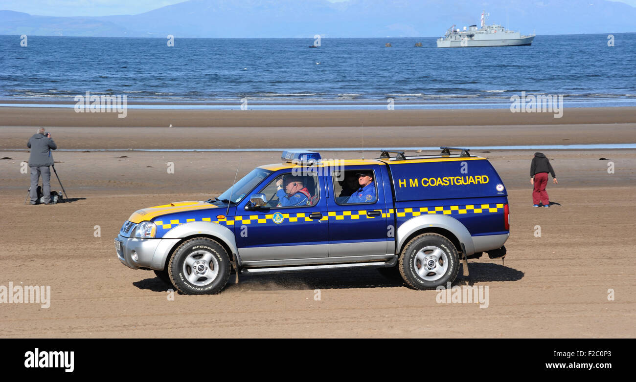 H M COASTGUARD VEHICLE WITH STAFF ON PATROL ON BRITISH BEACH RE SAFETY PUBLIC WATER DANGER DANGEROUS TIDES COASTAL COAST UK Stock Photo