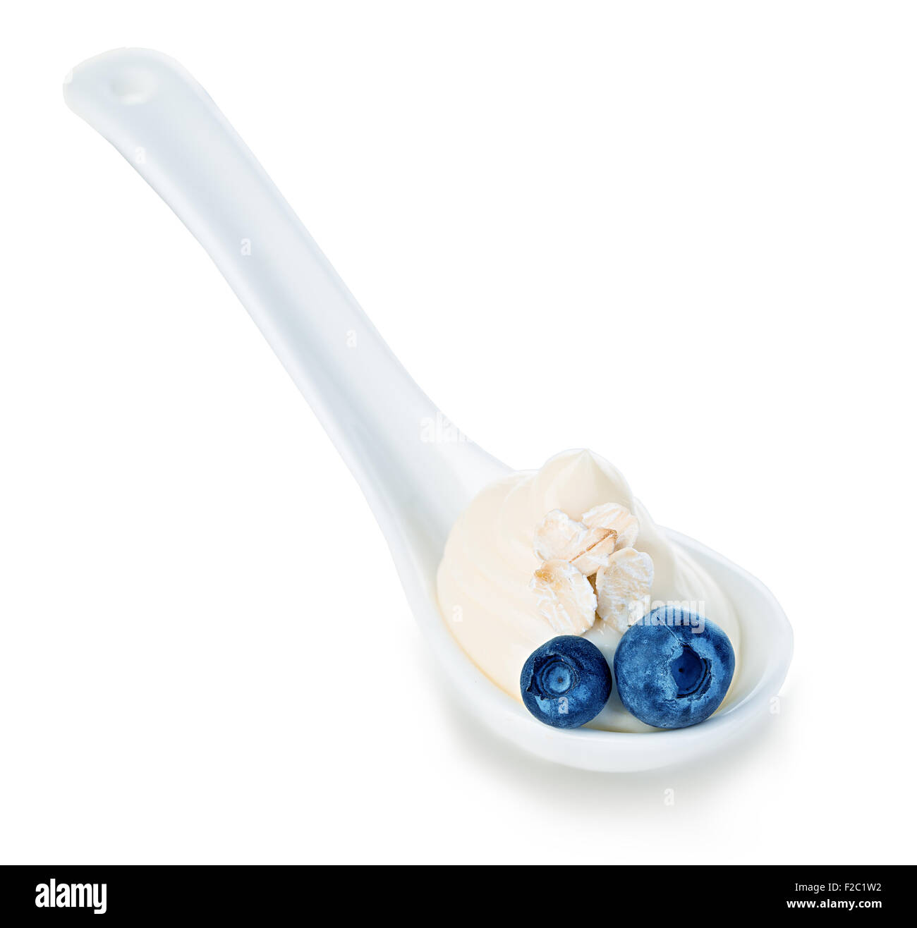 Spoon of blueberry yogurt isolated on white Stock Photo