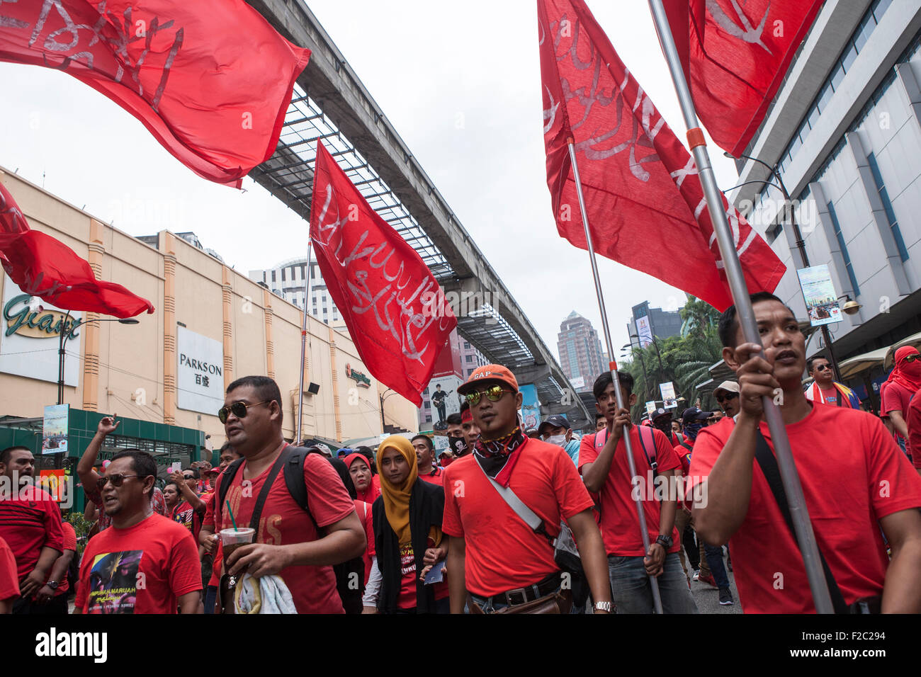 Kuala Lumpur, Malaysia. 16th Sep, 2015. Pro-government red shirt protesters take part in a demonstration in Kuala Lumpur, Malaysia, Wednesday 16 September, 2015. Thousands of pro-Malay demonstrators took to the streets of  Kuala Lumpur on Wednesday in a rally seen as promoting Malay supremacy in the multi-racial nation. Senior political figures and opposition parties voiced concern the rally could inflame racial tensions at a time when Prime Minister Najib Razak is under intense pressure to resign over an alleged corruption scandal. Credit:  Asia File/Alamy Live News Stock Photo
