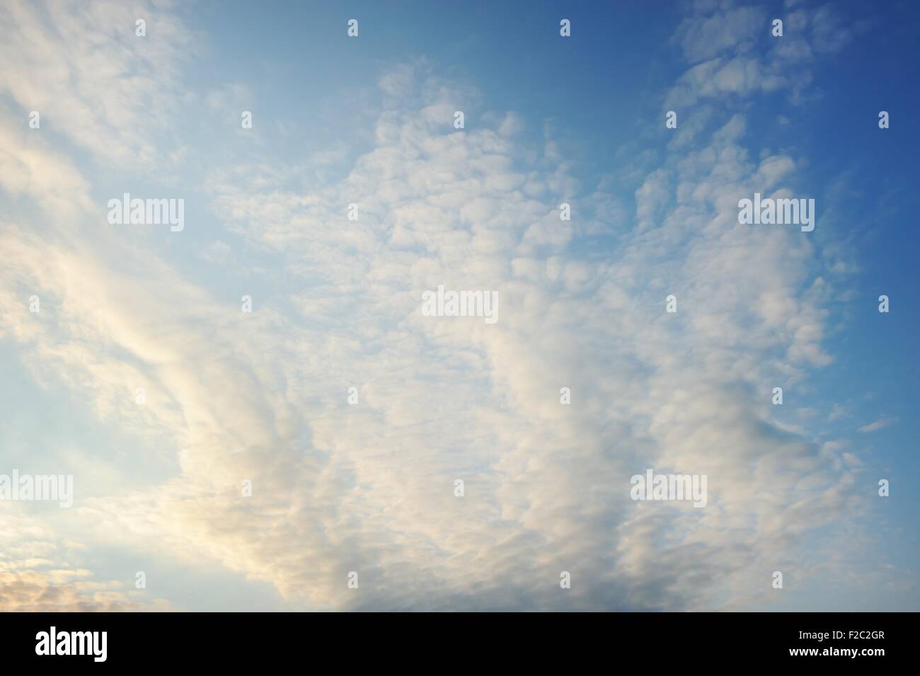 Blue sky with fluffy clouds Stock Photo - Alamy