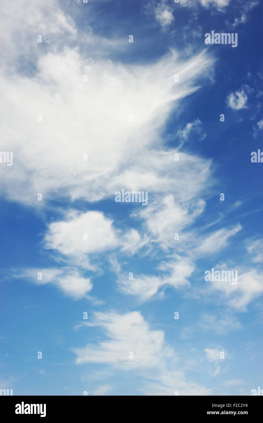 Blue sky with fluffy clouds Stock Photo - Alamy